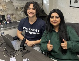 Ephraime Bennett and Hina Shehzad at a desk with computer equiptment