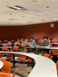 Blaine Montford and Tony Miklovis sitting in a classroom preparing