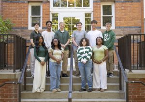 MSU Debate Team students on steps in front of brick building PC: Sloane Barlow Photography